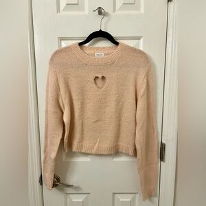 Cropped sweater with heart cut out